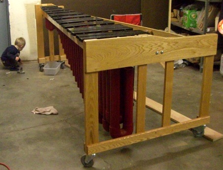 Child explores marimba
