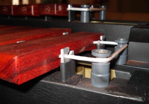 Modified marimba end post